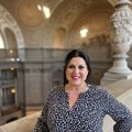 Martha Yanez at City Hall, wearing a black and white top and hair tied back