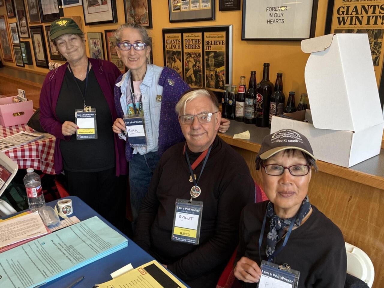 Poll workers smiling for a photo