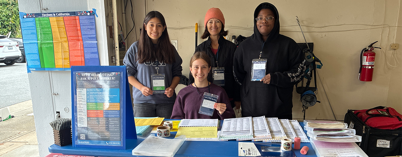 A group of poll workers at the election table at a polling place