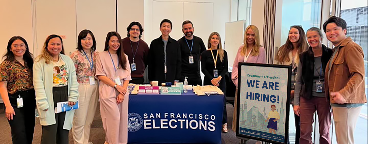Group picture of a dozen Department of Elections staff at a Job Fair.