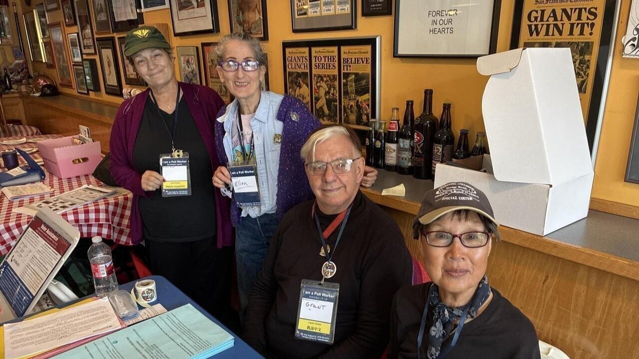 Goup of Poll Workers posing for a picture