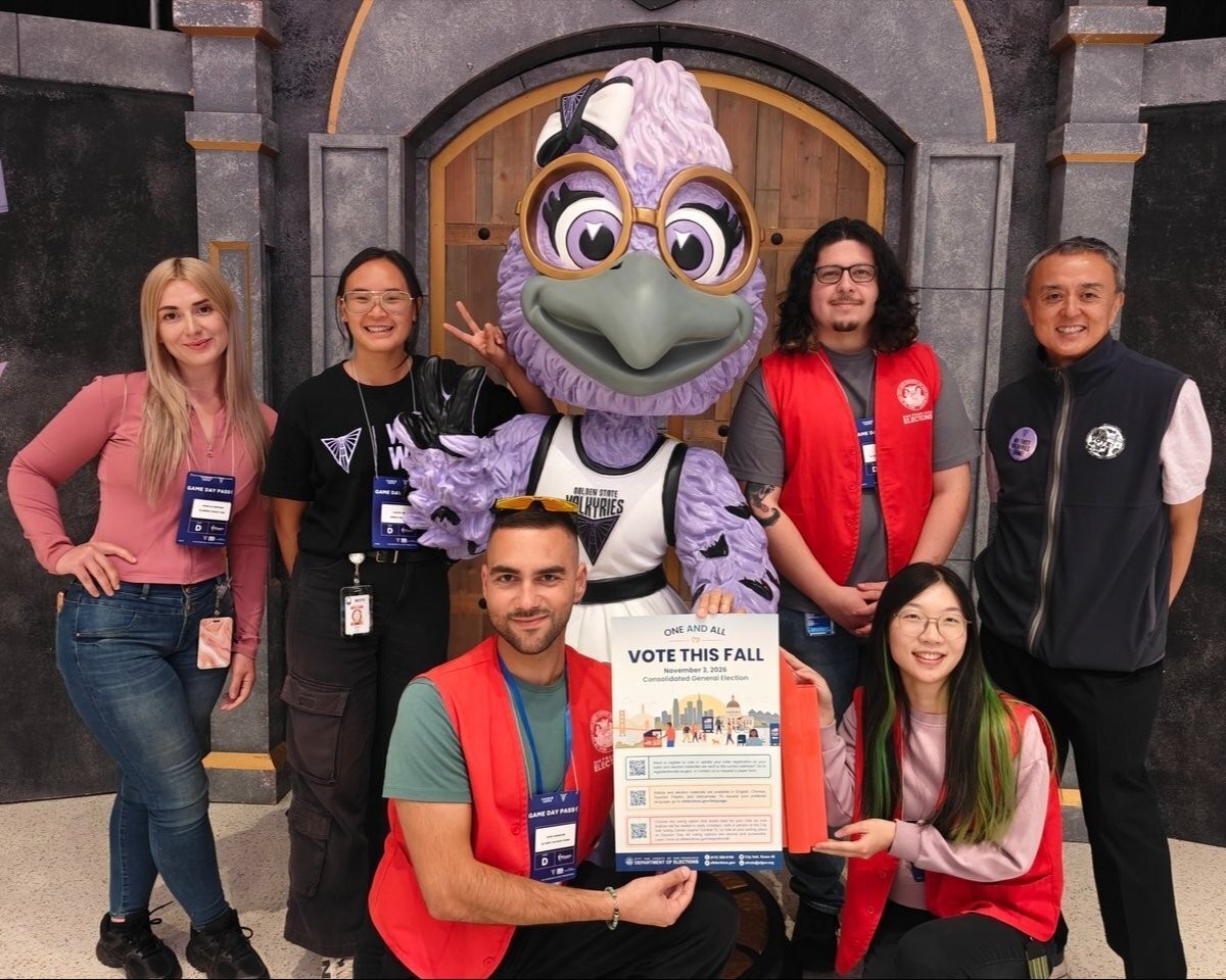 SF Department of Elections and Alameda ROV staff pose for a group picture at the Valkyries game at the Chase Center