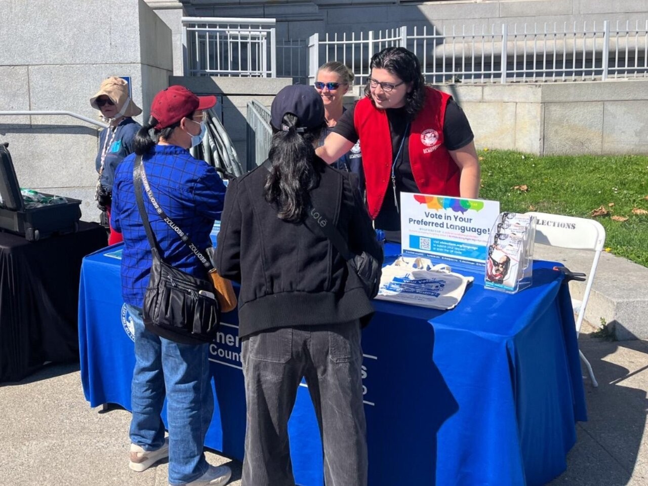 Elections staff hosting a voter resource table in front of SF City Hall