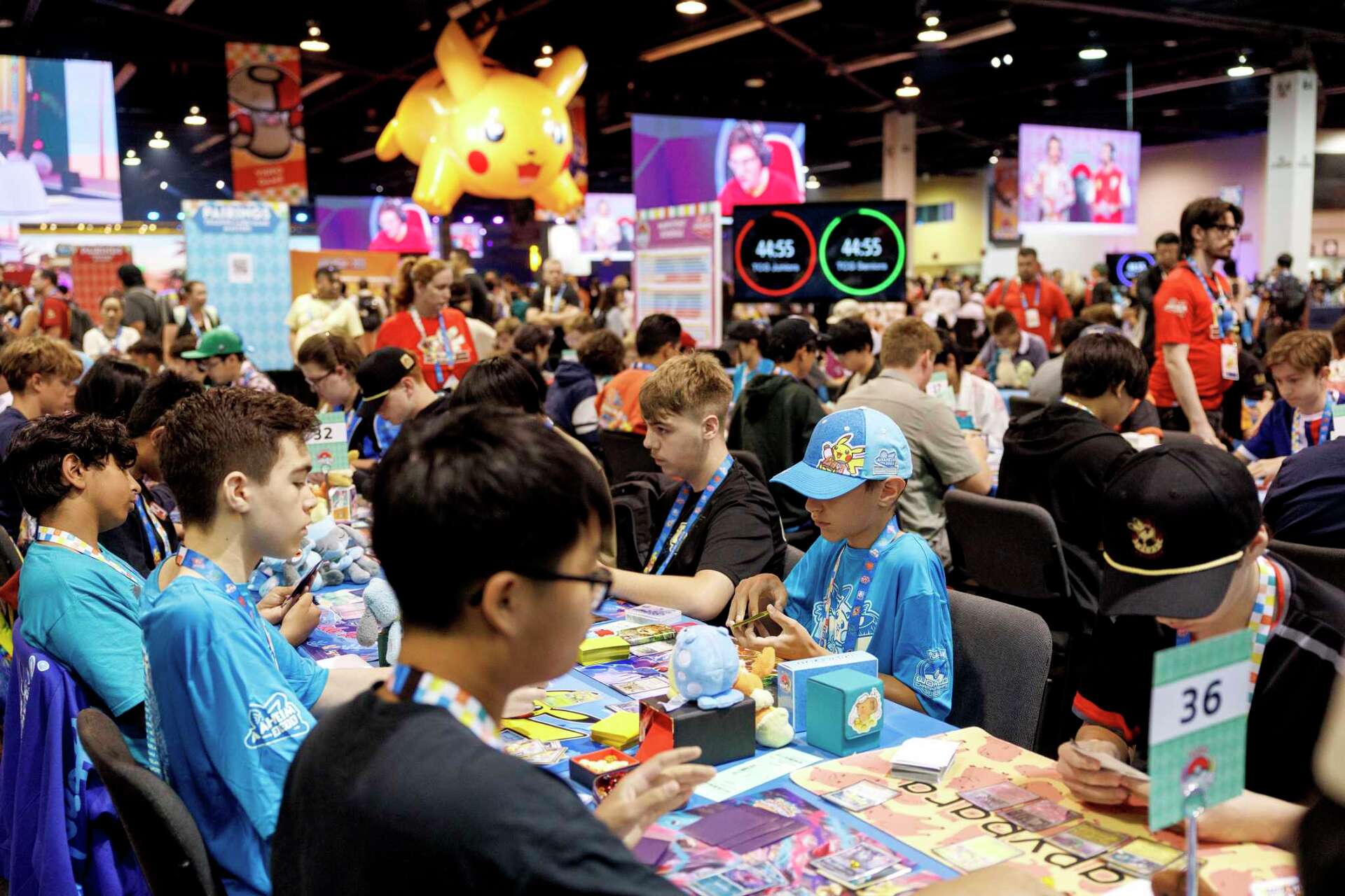 Kids competing in a pokemon game