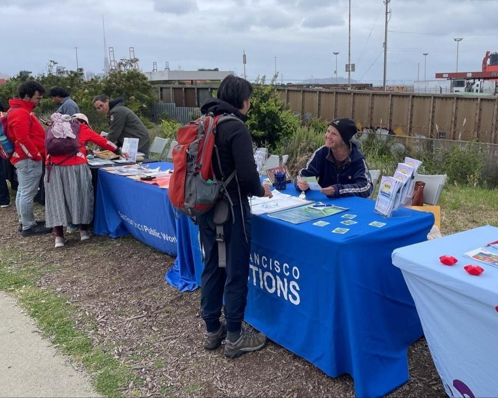 Department of Elections staff talking to an SF Resident at the Earth Day Festival