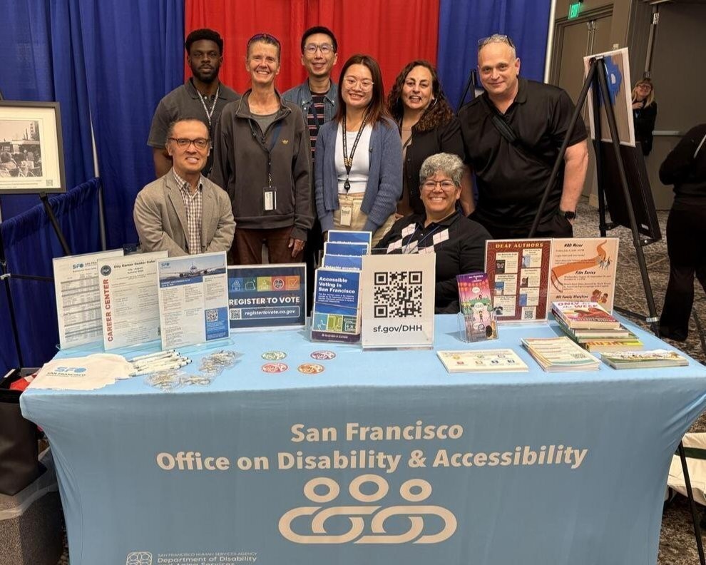 Elections staff posing with various other organizations at the National Association of the Deaf Conference.
