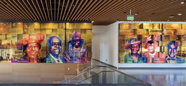 A photo of a mural inside of the PUC building with 6 individuals of color portrayed