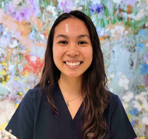 woman in front of flowers