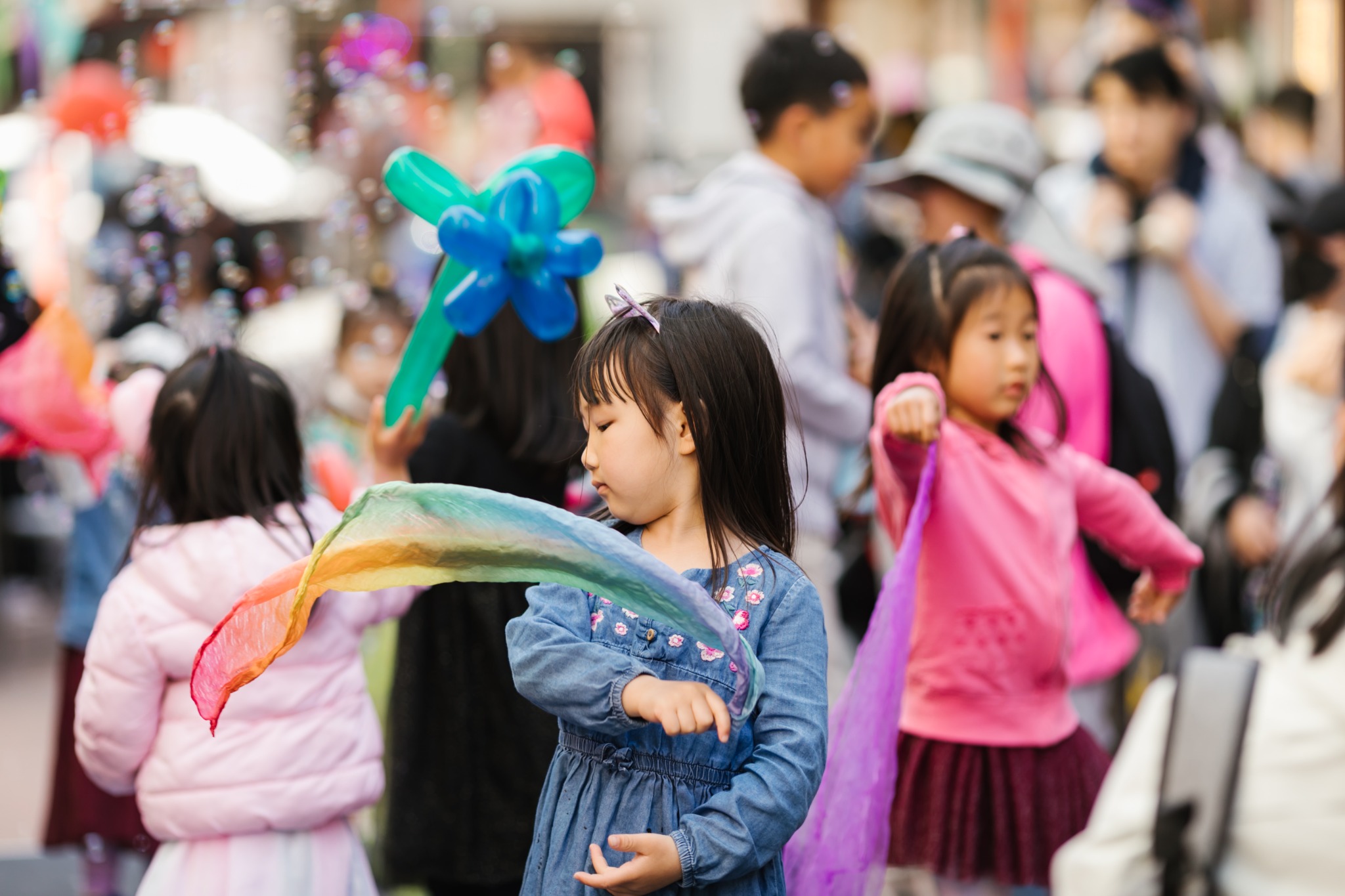 Girl playing with ribbon