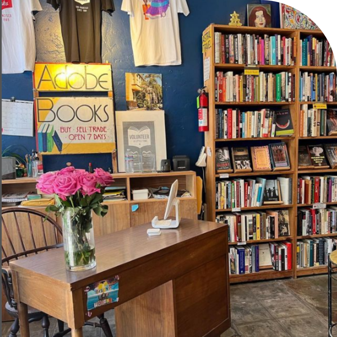 photo of a desk and a shelf of books