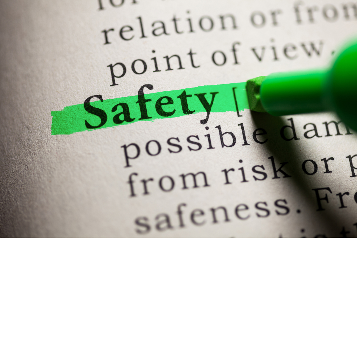 A photo of the word safety highlighted in green in a dictionary