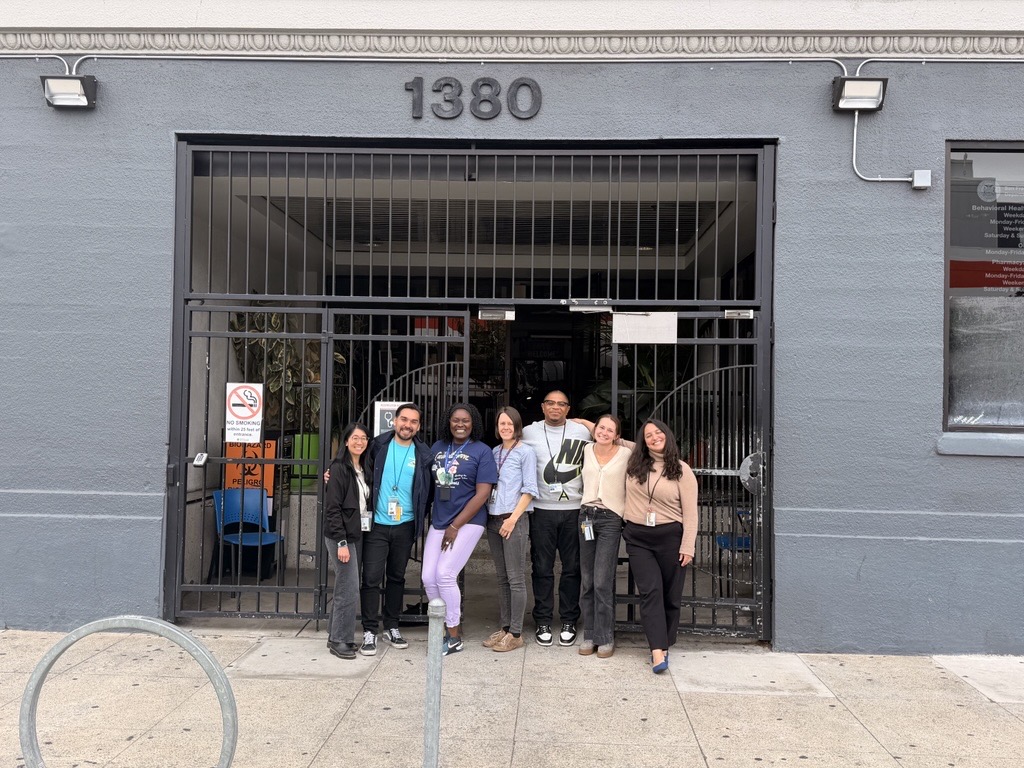BEAM Clinic Team members in front of clinic building at 1380 Howard