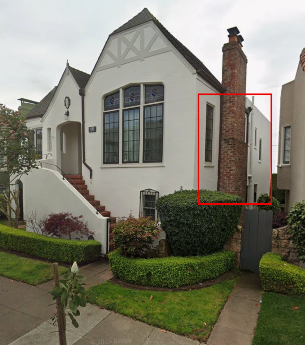 A house with a red box drawn over several windows on the side of the building that's perpendicular to the street.