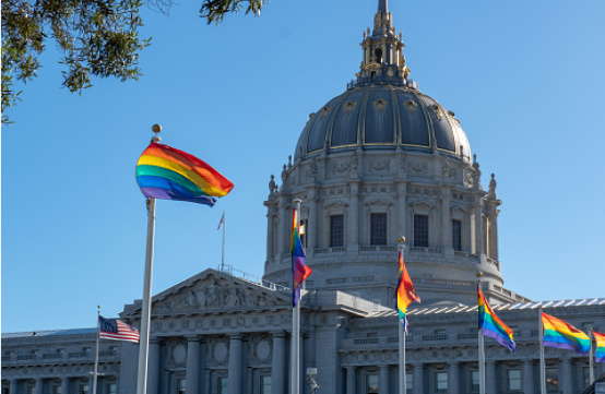 Pride flags outside of city hall.