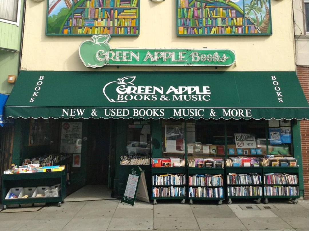 Green Apple Bookstore with racks of books out front