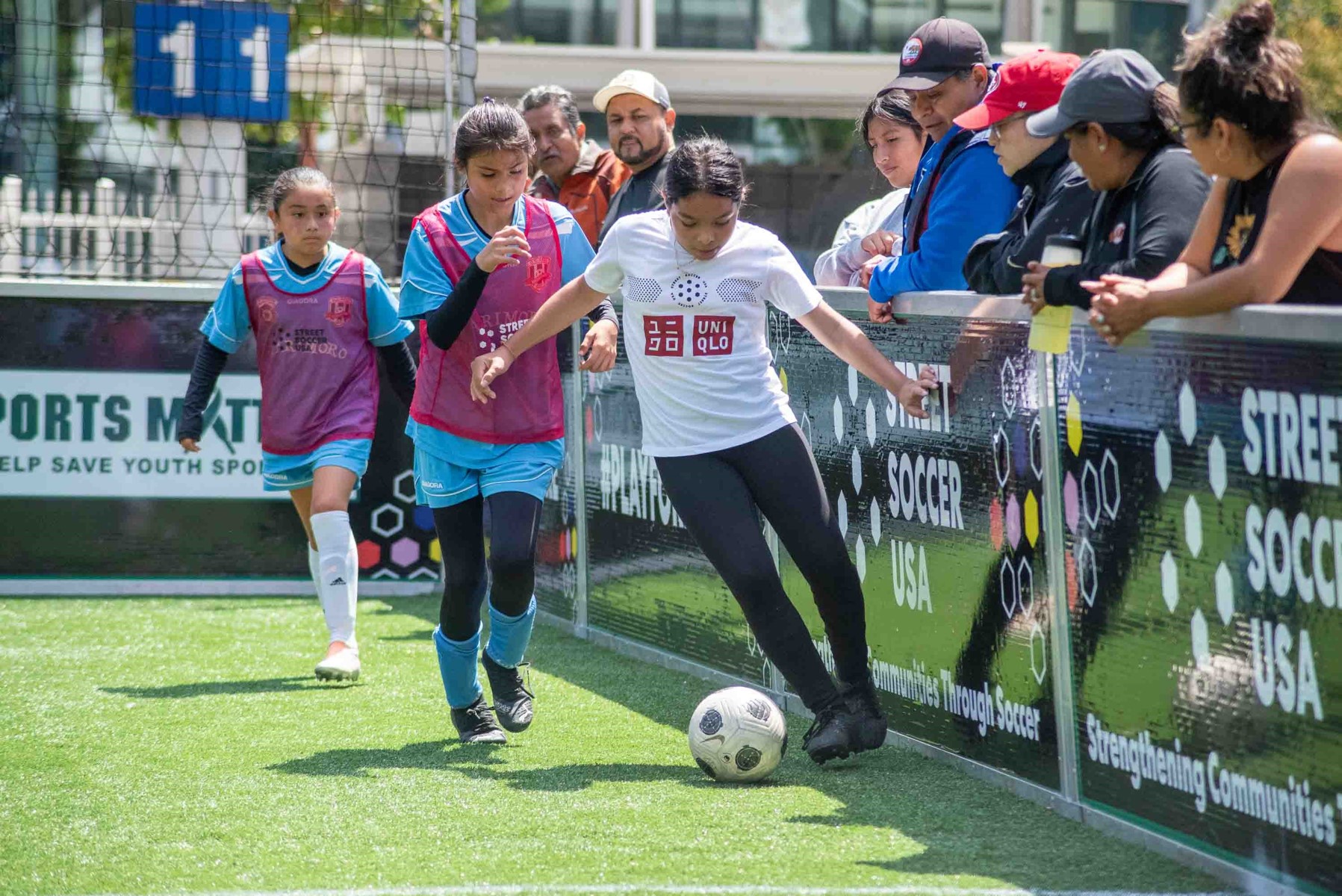 Girls playing in a soccer game