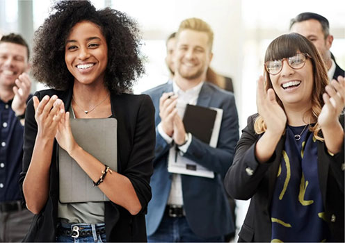 Employees cheering and clapping