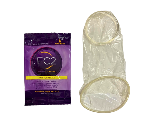 An FC2 internal condom in its wrapper, and next to it another FC2 internal condom unwrapped
