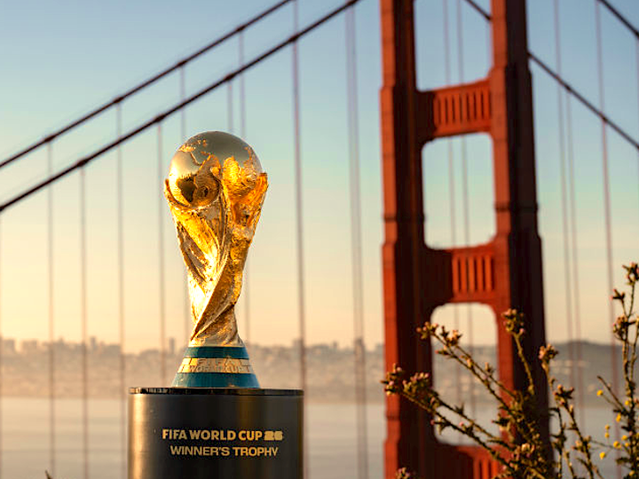 The gold FIFA World Cup trophy with the golden gate bridge in the background