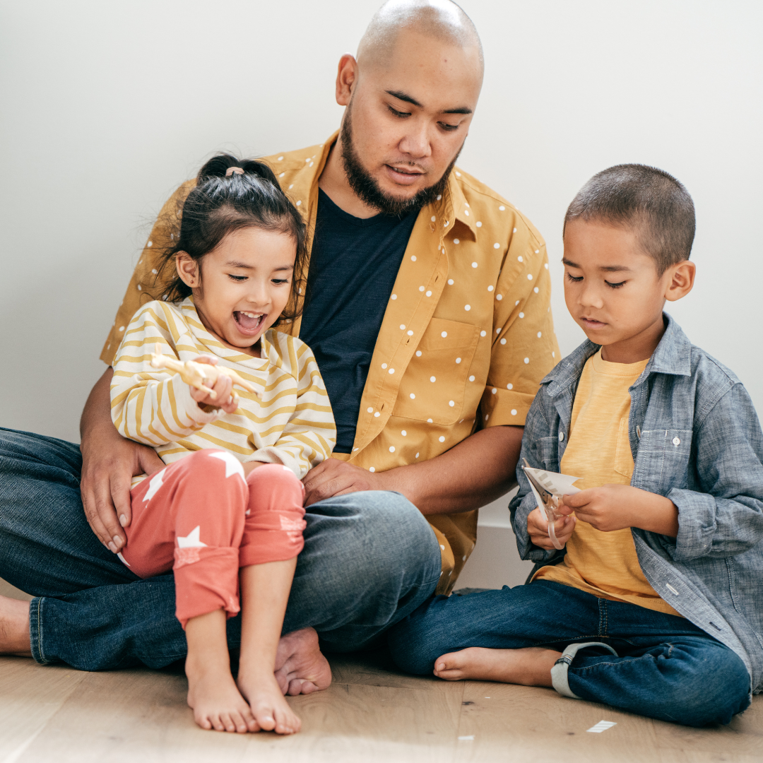 Father with two kids on lap