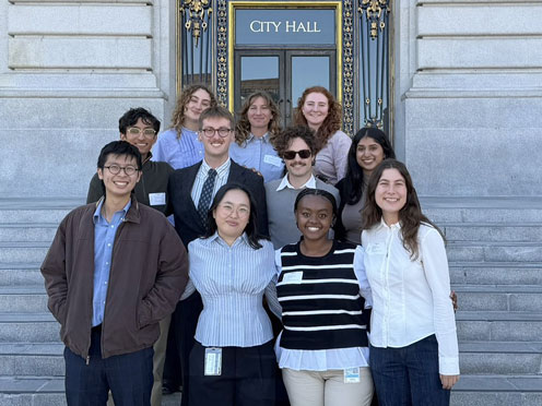 A group of SF Fellows (2026-27) standing in front of the City Hall steps.