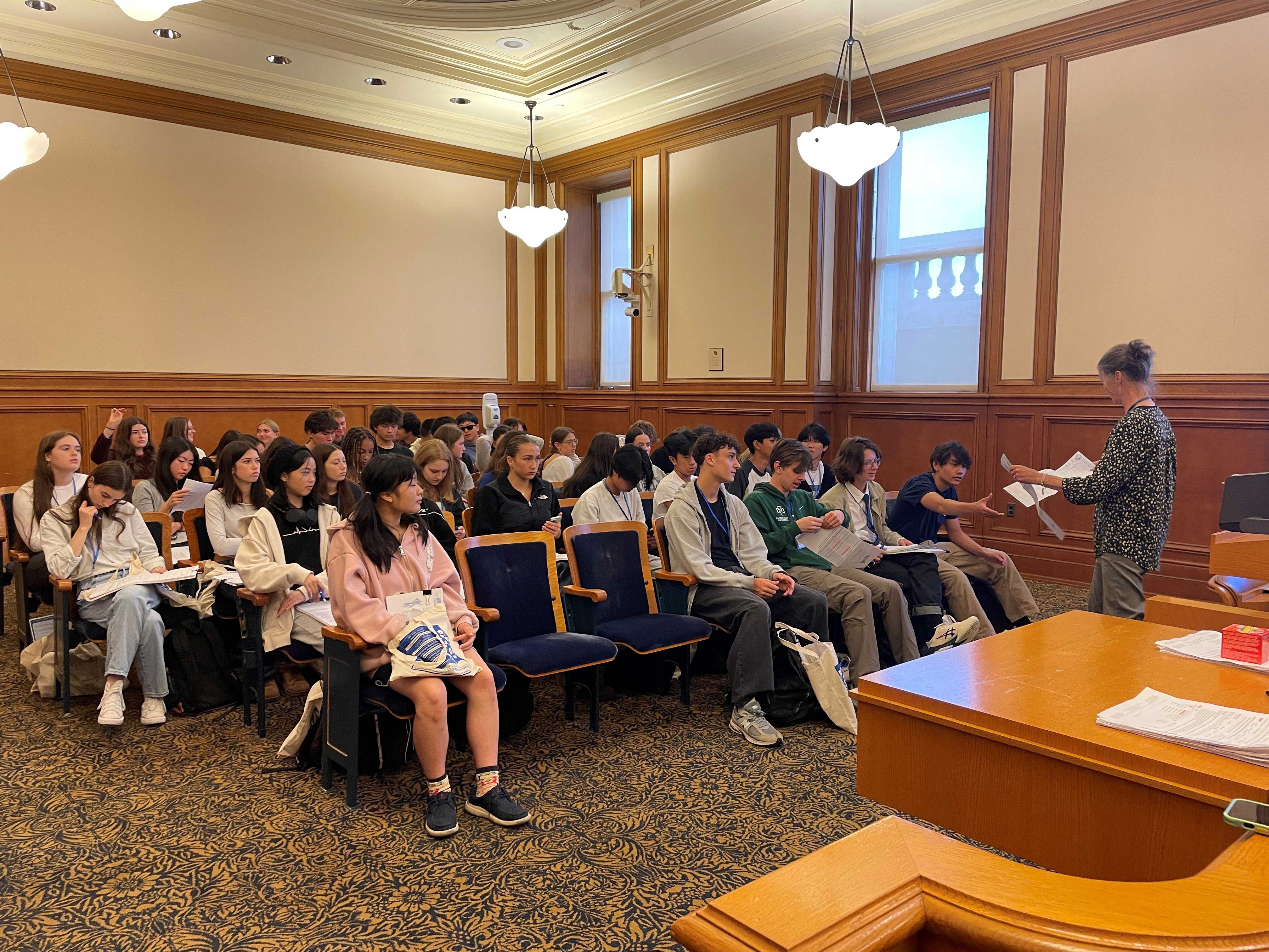 Elections Outreach member speaking to 3 dozen high school elections ambassadors.