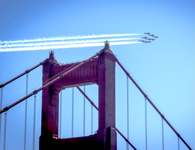 Jet fighters practice for San Francisco's Fleet Week above the Golden Gate Bridge