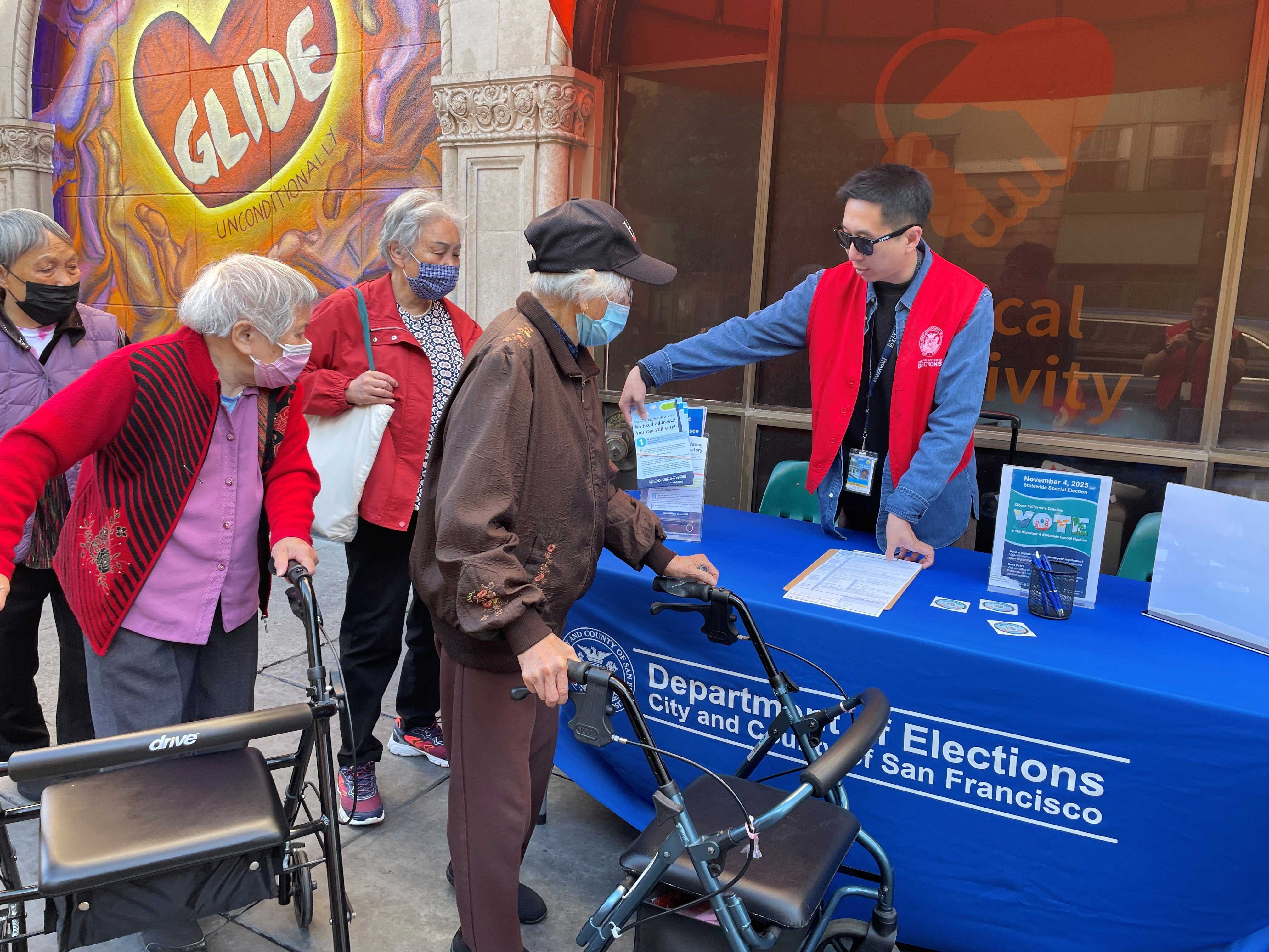 Elections Outreach Table at GLIDE. Speaking with 4 senior residents of SF.