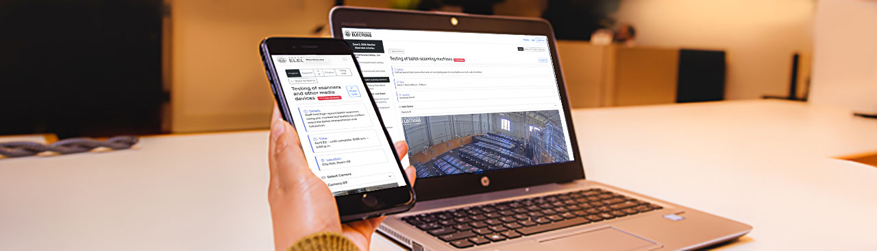 The Livestream webpage of the Department of Elections website on a laptop and smart phone.