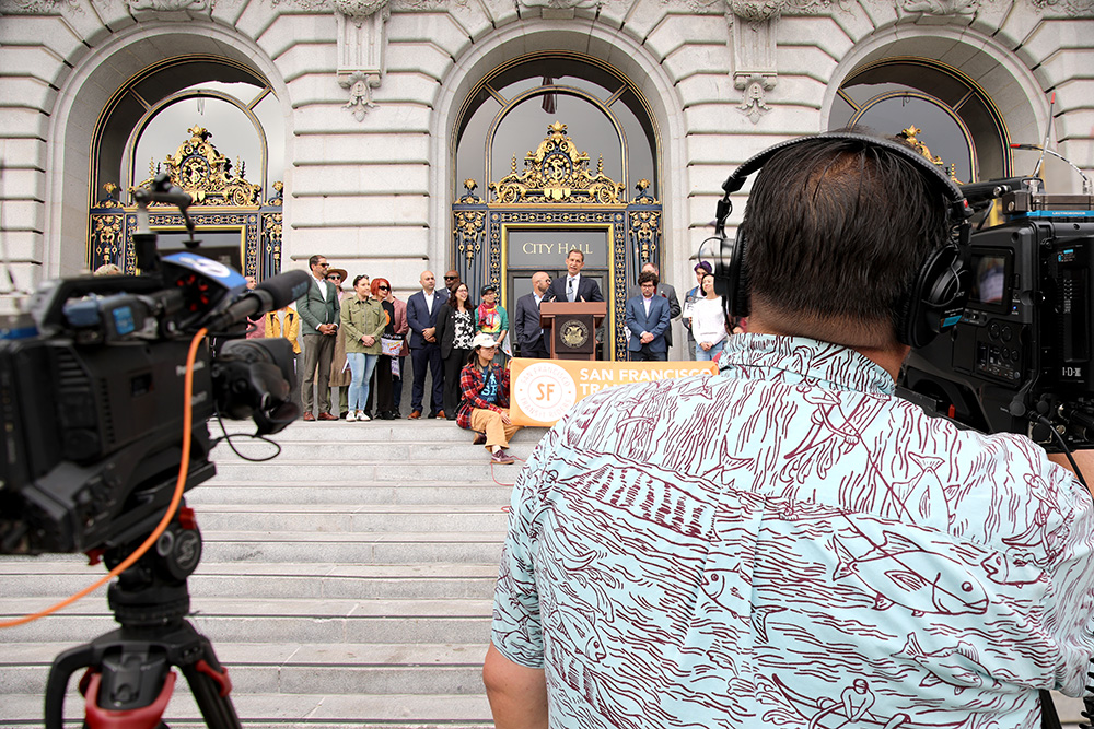 Mayor Lurie addressing the press from the steps of City Hall