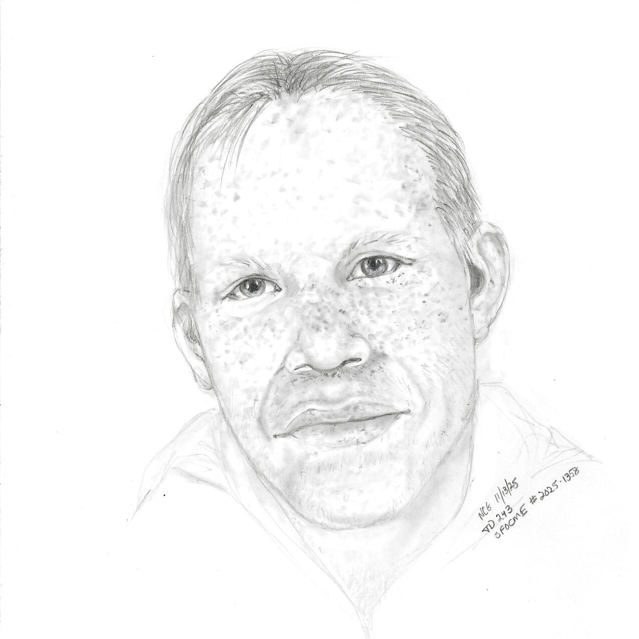 Pencil drawing of a male with freckles.