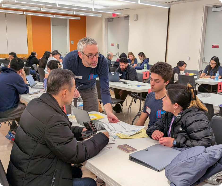 SFPCI attorney reviews workshop participant's naturalization application at the SF Public Library
