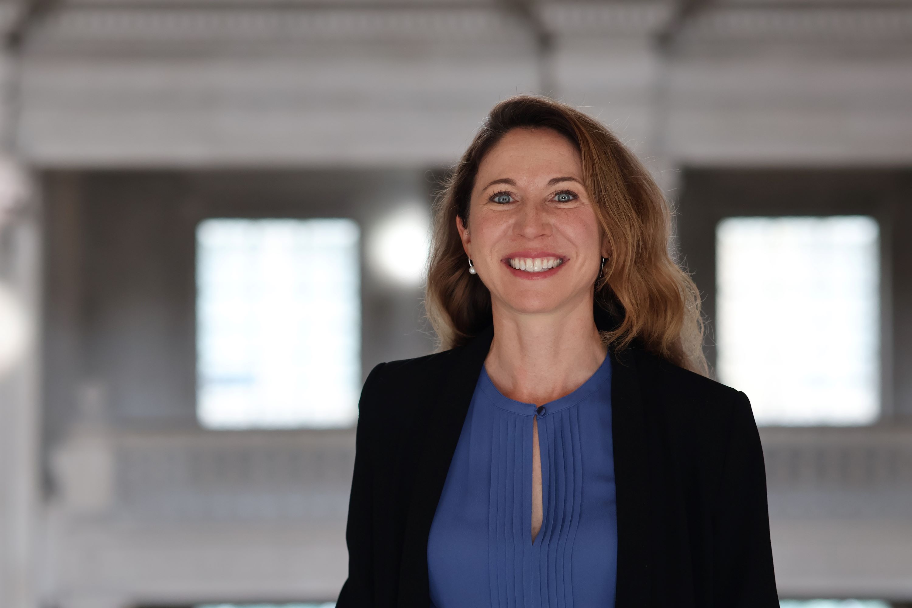 Smiling woman with long blonde hair