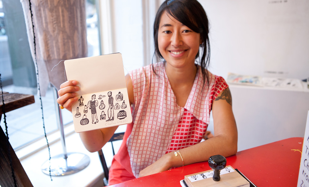 Woman Holding a Sketch Book representing a Passport