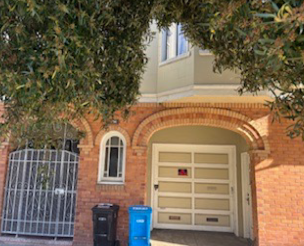 light green building with red brick trimming - the SEOP Transitional Housing is located here