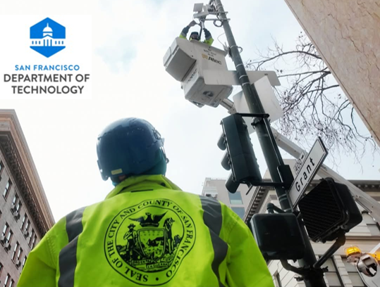 SFWiFi being installed at Dragon Gate with Department of Technology Logo