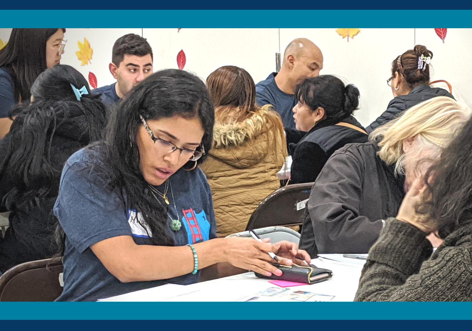 Volunteer helps participant fill out citizenship paperwork