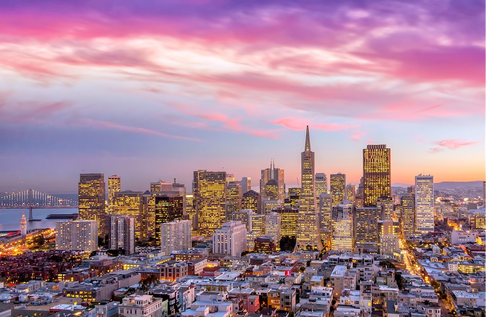 San Francisco buildings under a pink and purple sunset