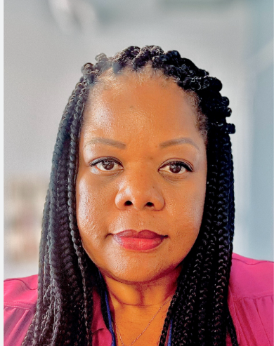 Picture of Chief Cristel Tullock. An African American female om a pink blazer