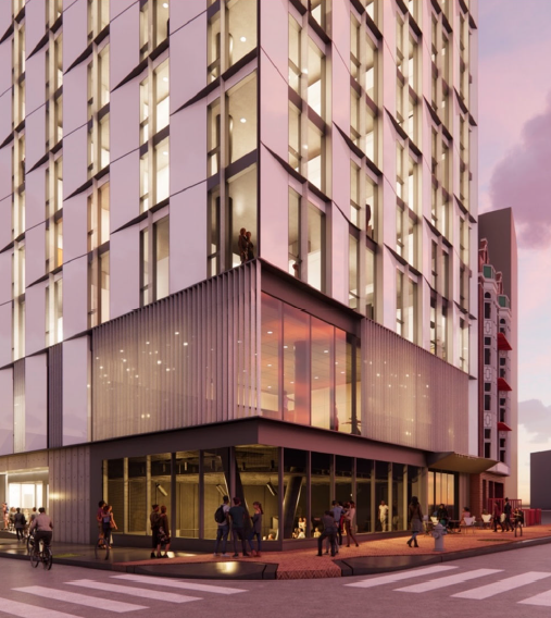 Rendering of a tall modern apartment building at street level, with people walking and biking outside near large windows and ground-floor community space.