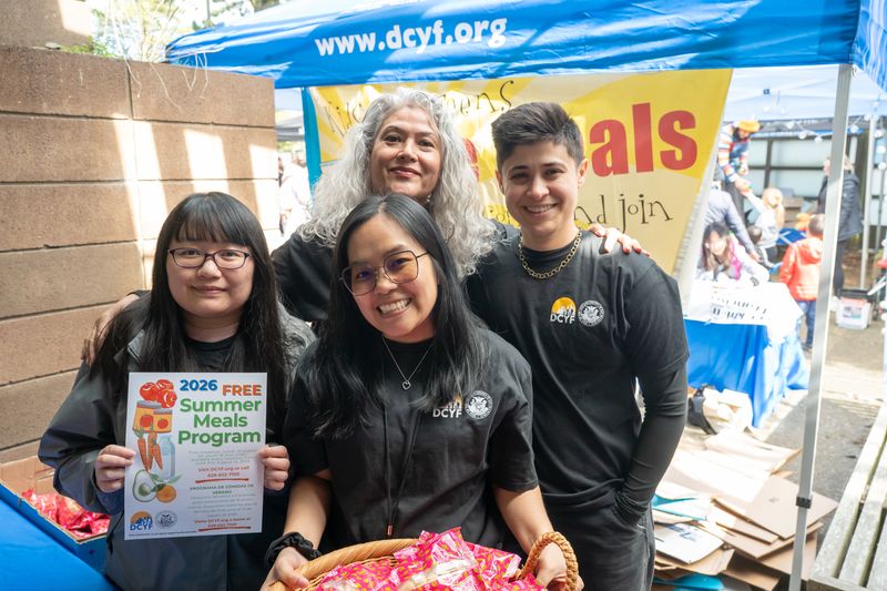 4 women holding a sign about the DCYF nutrition program