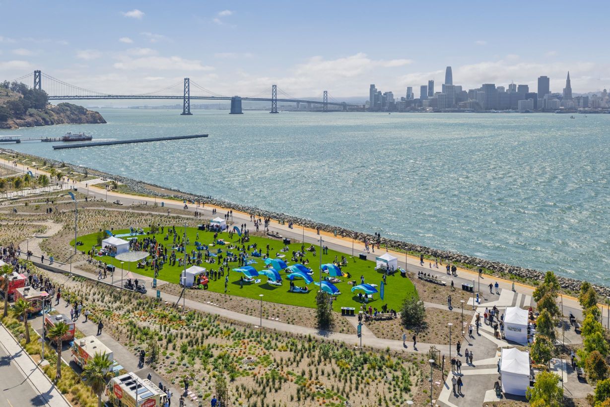 People having a picnic on the Cityside Park Lawn on a sunny day