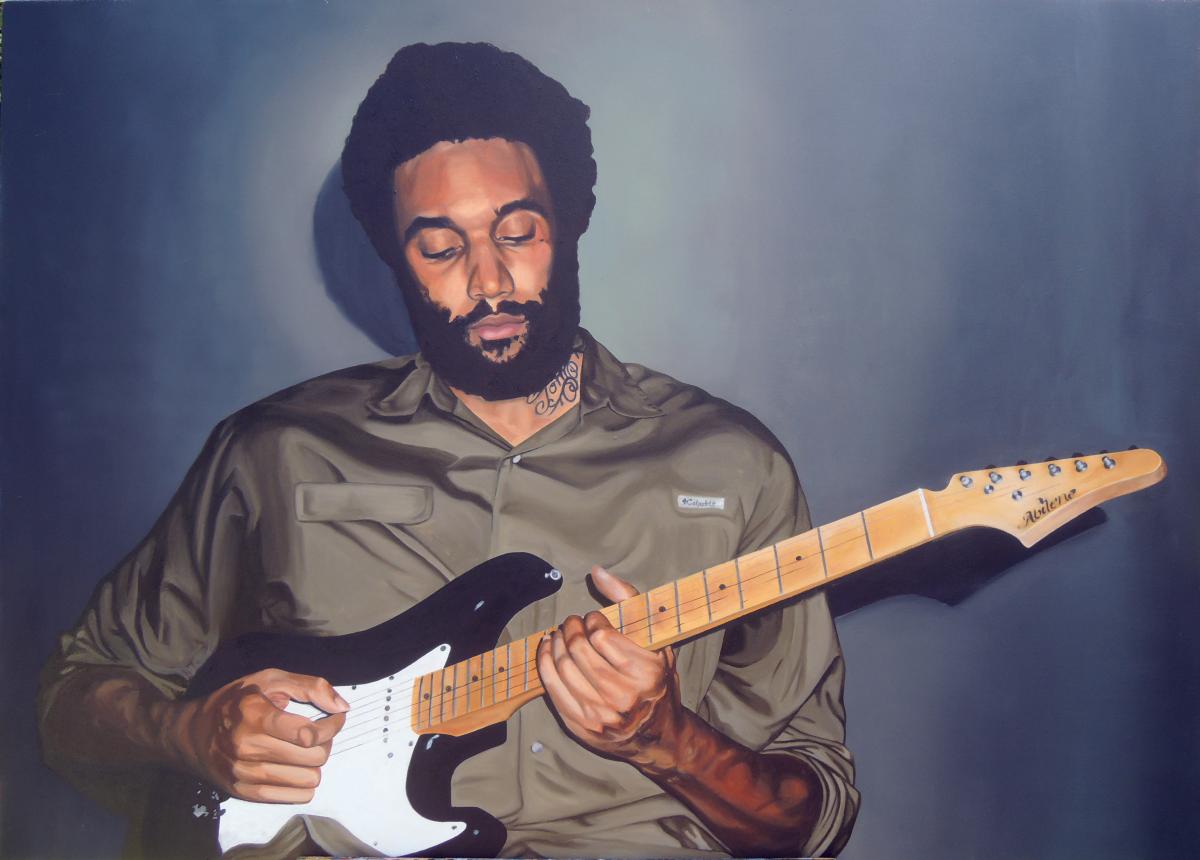 A man playing a guitar