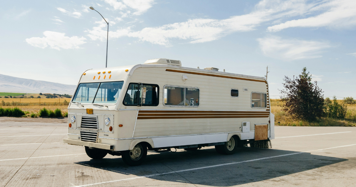 white and blue bus on road during daytime