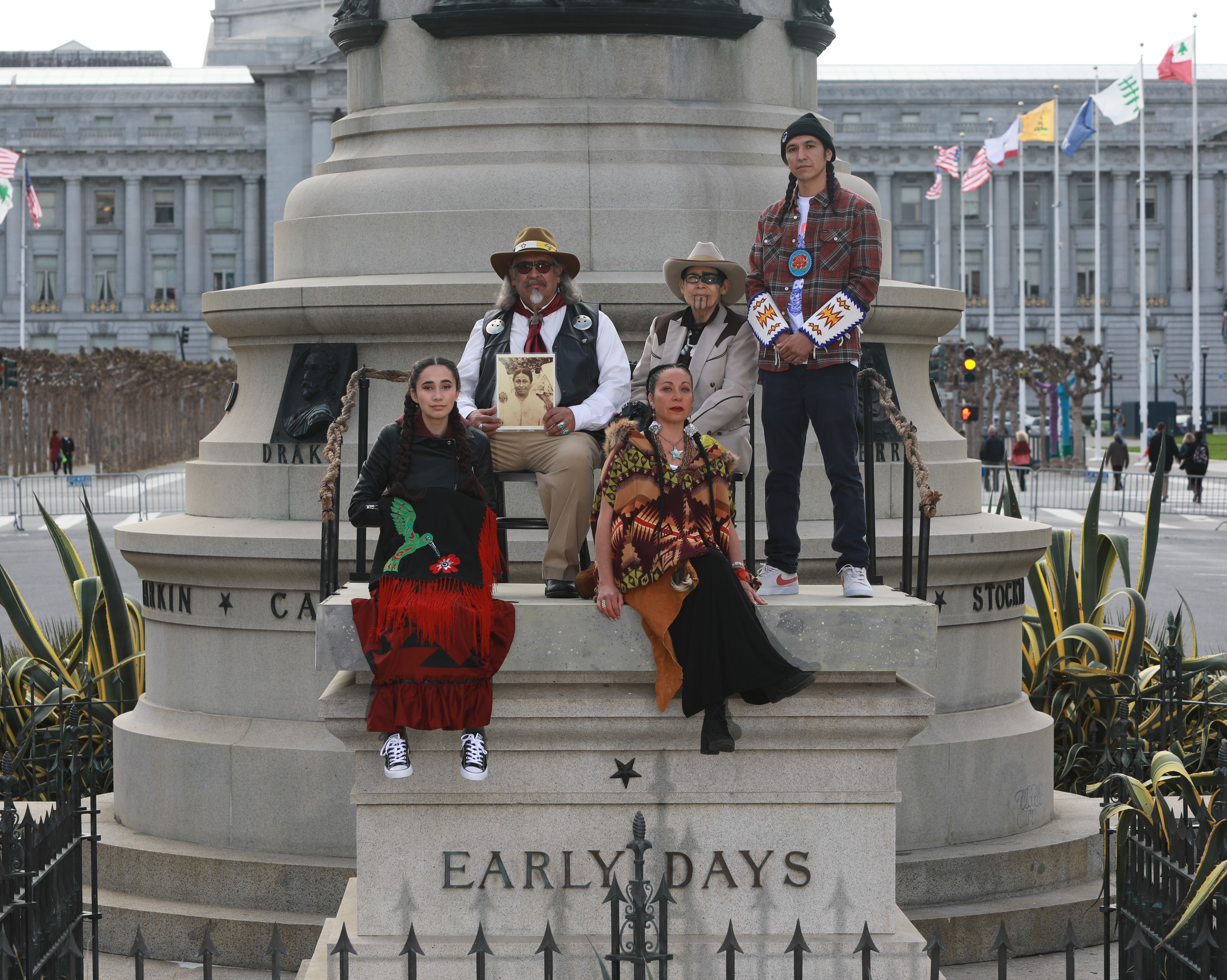 Image of five Native Americans situated on top of the Early Days plinth