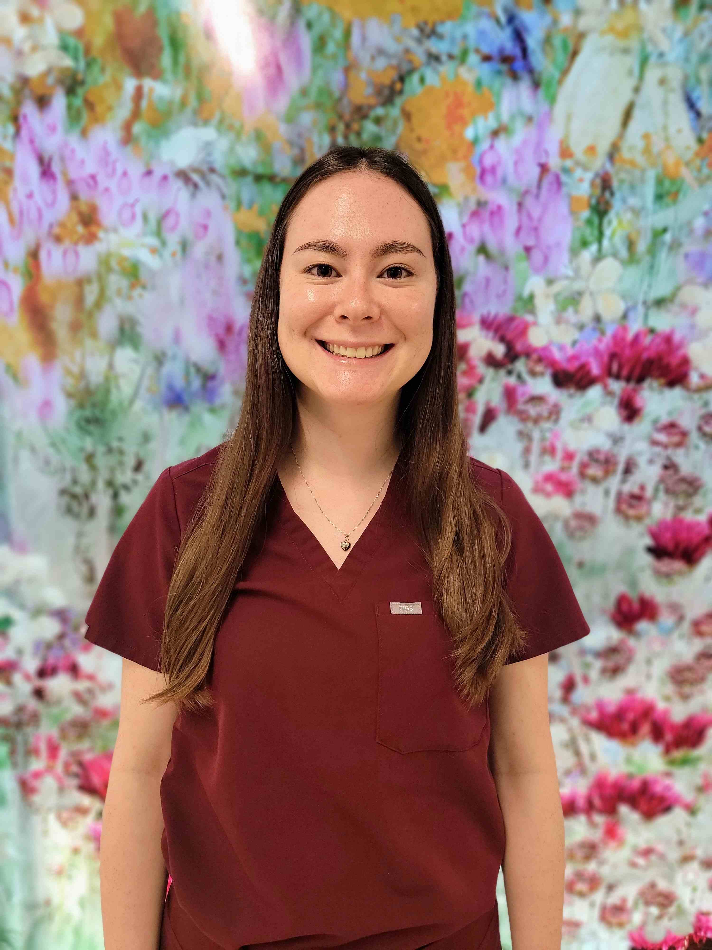woman in front of flowers