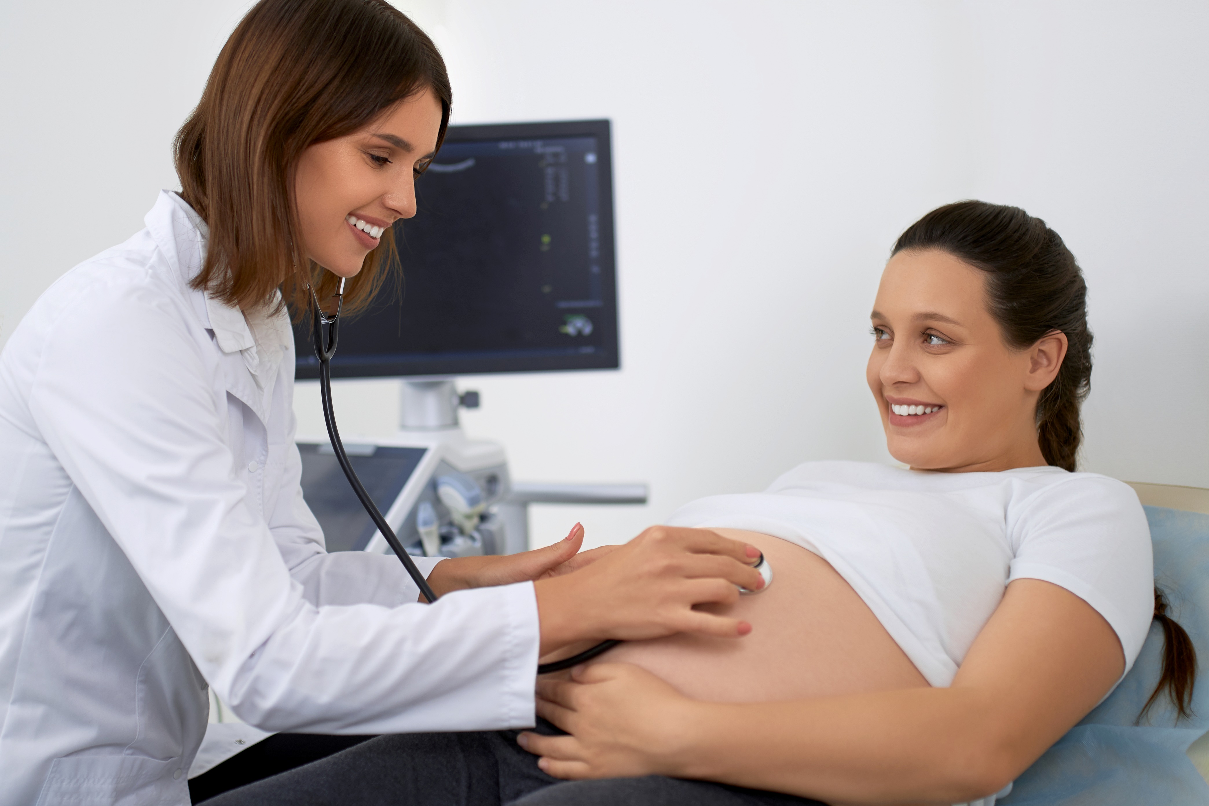doctor examining pregnant woman
