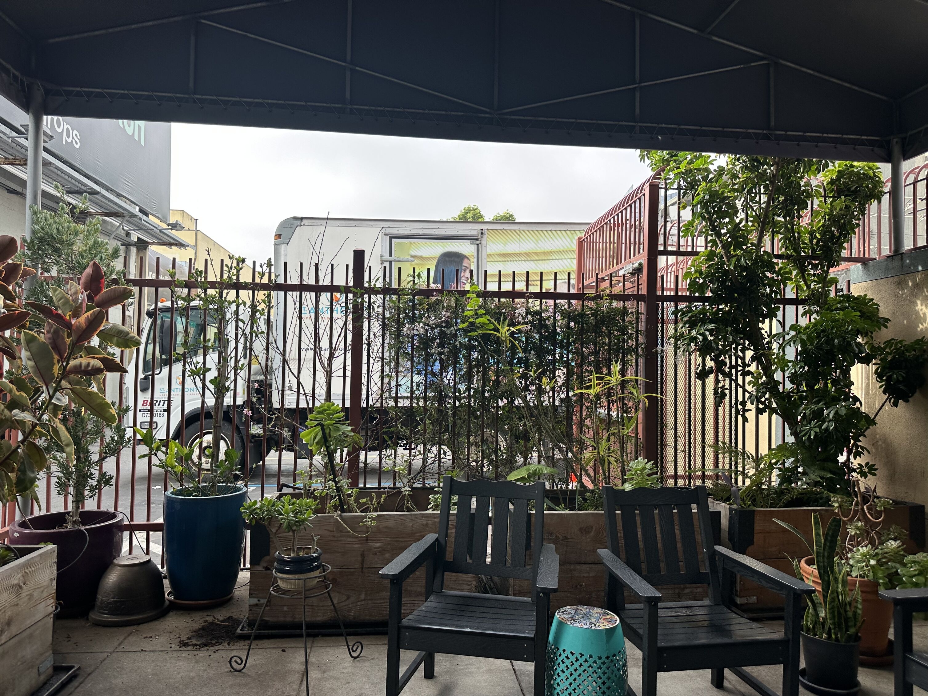 front patio with two chairs and plants at sobering center