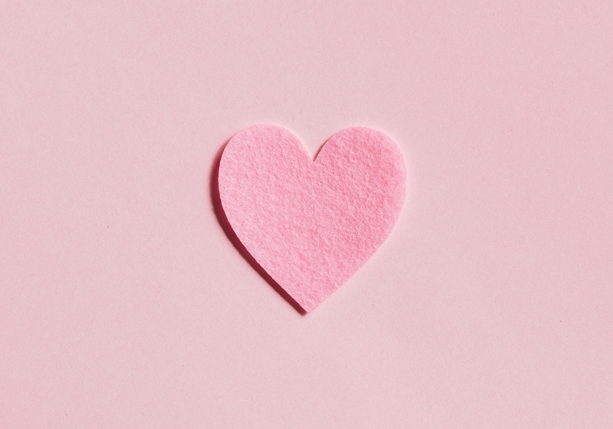 pink paper heart on a pink background