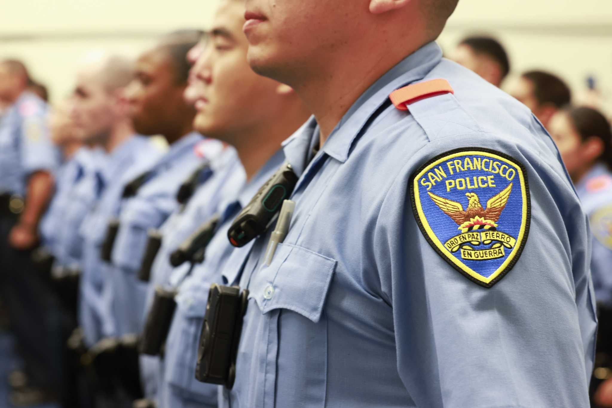 An image of SFPD recruits, highlighting the SFPD badge